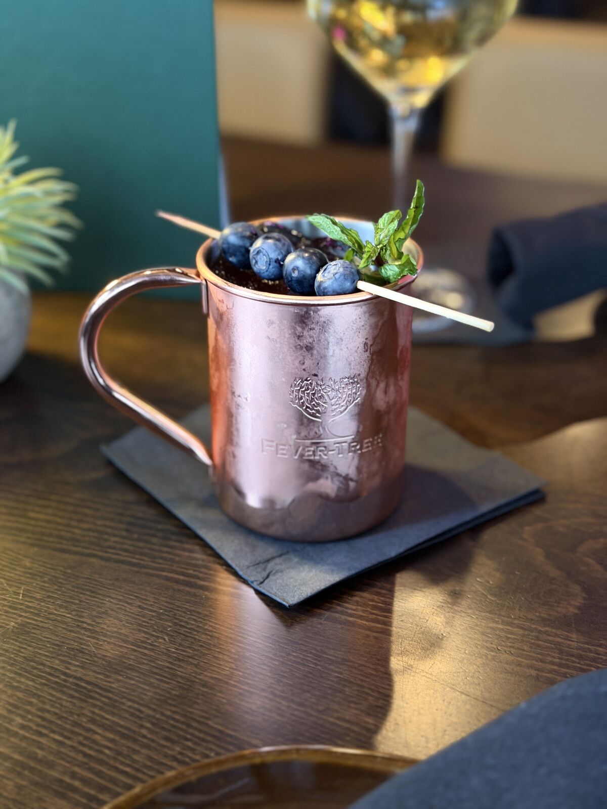 Copper mule mug with fresh blueberries