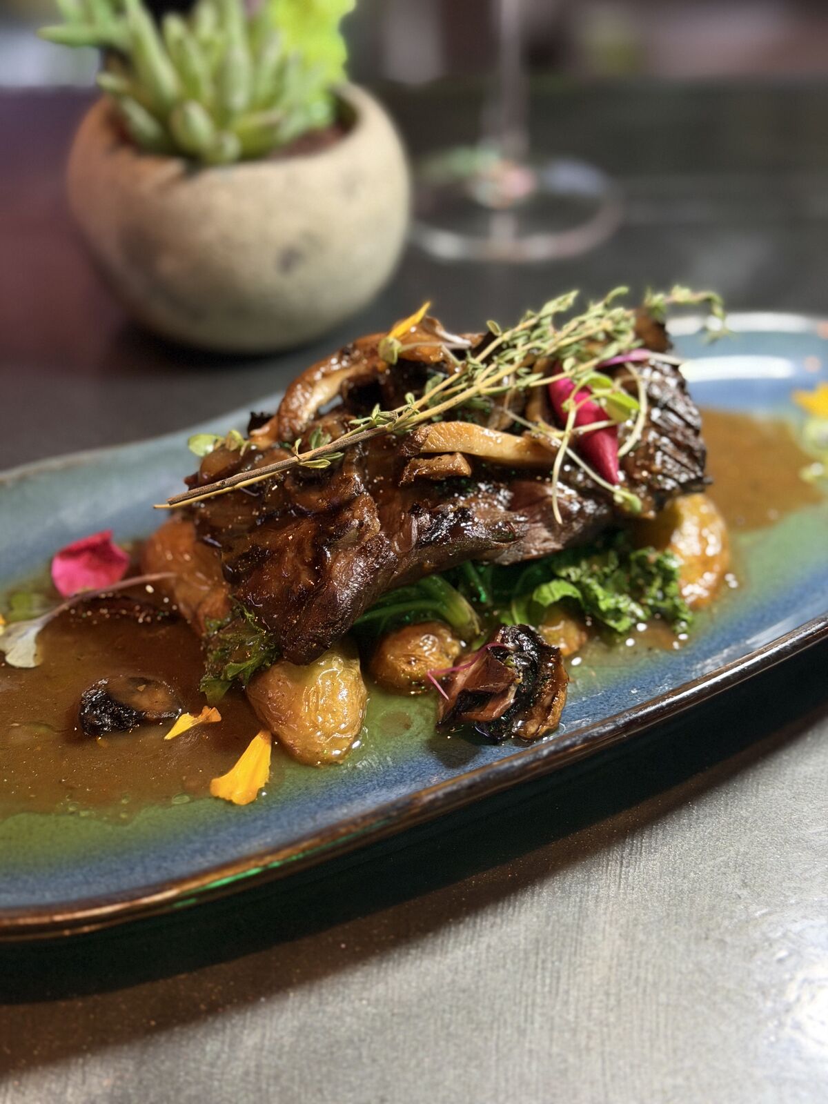 Hanger steak with wild mushrooms, wilted kale and fingerling potatoes